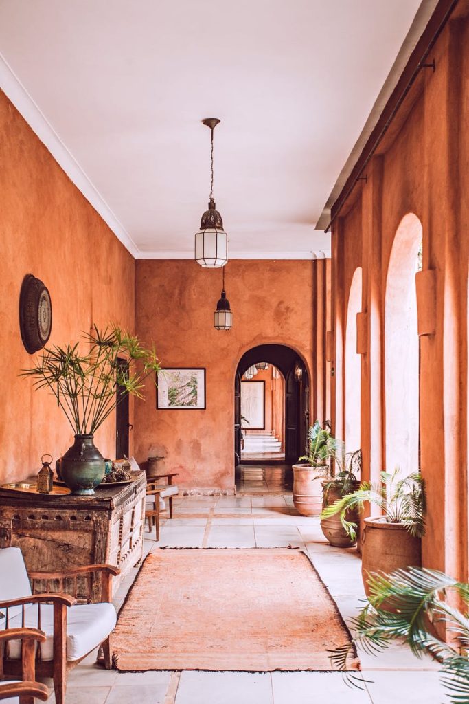 interior of spacious rustic patio with arched doors